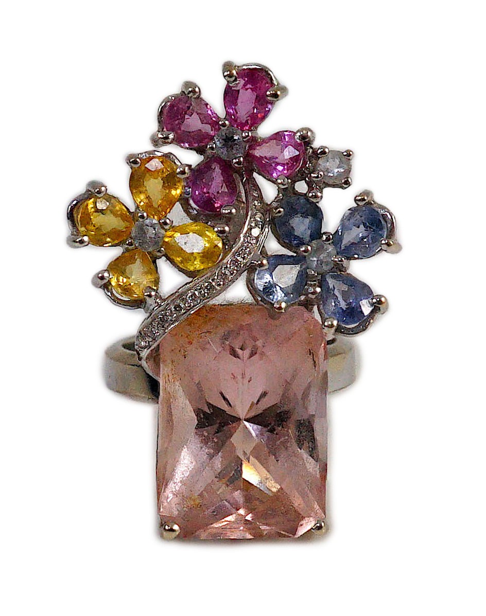 A large modern 14k white gold, morganite, four colour sapphire (including colourless) and diamond chip set triple flower head dress ring, in a raised setting